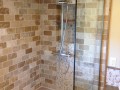 travertine and pebble shower